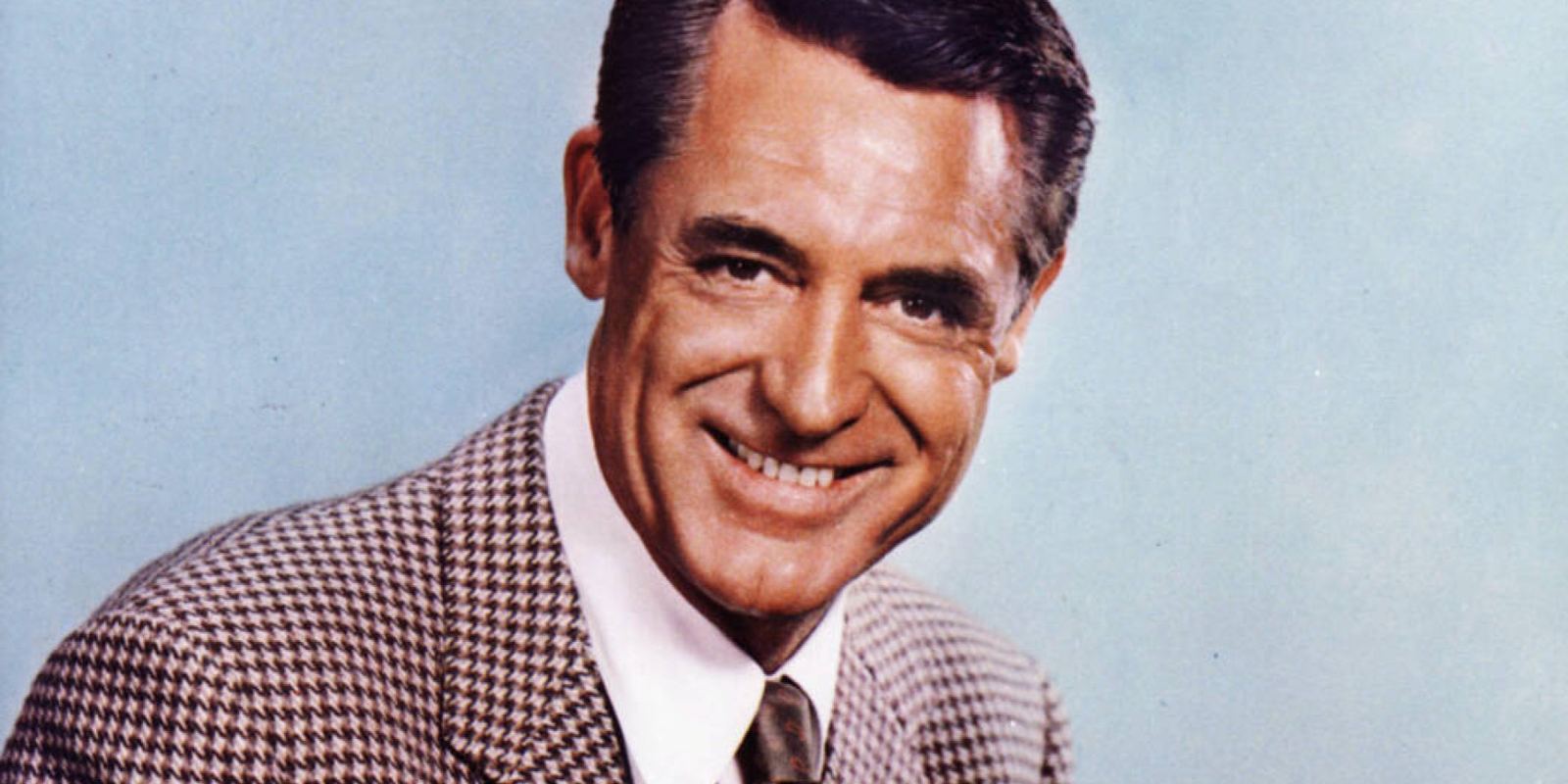 Color portrait of Cary Grant in a suit and tie, 1958