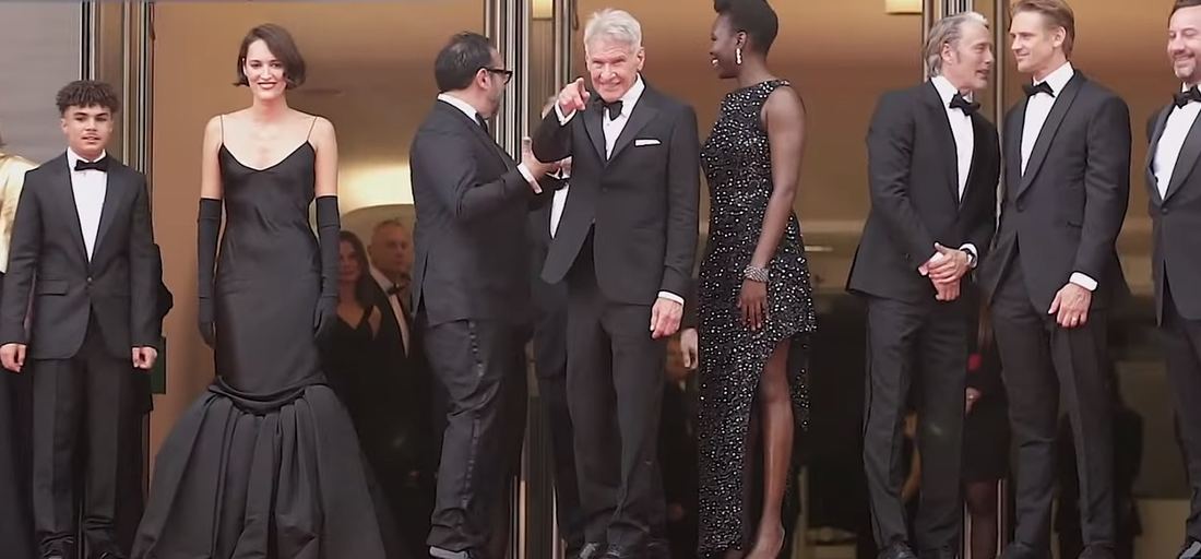 Harrison Ford with cast and crew on the red carpet at Cannes in 2023