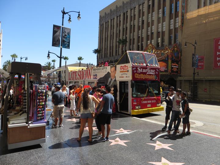 Coral and charcoal stars set into the sidewalk on Hollywood Boulevard