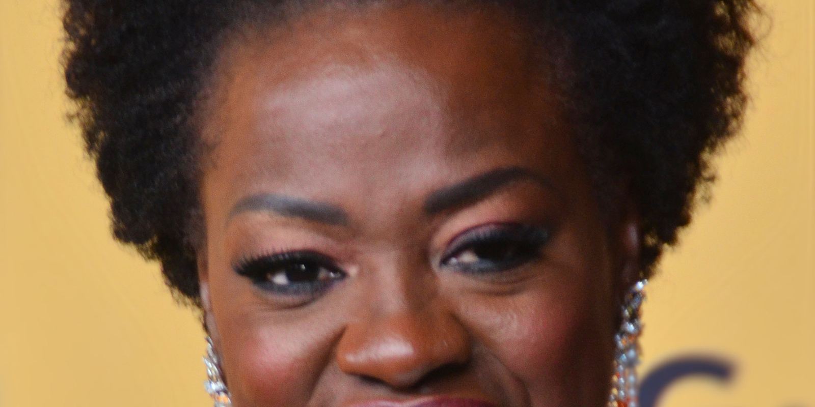 Viola Davis smiling on a red carpet in June 2015